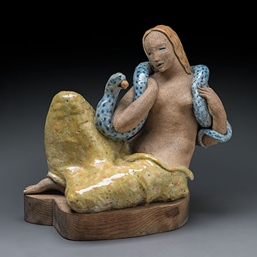 sculpture of a seated female figure with a snake that is holding an apple draped around her shoulders